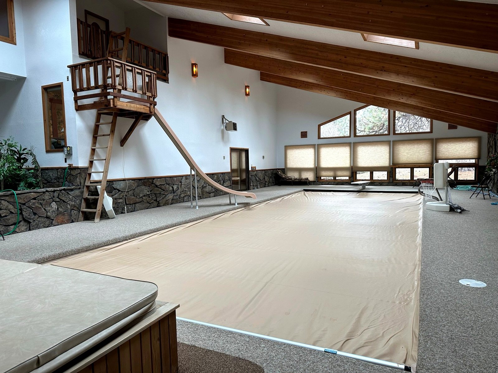Indoor pool with waterslide — ideal for family vacations on Flathead Lake